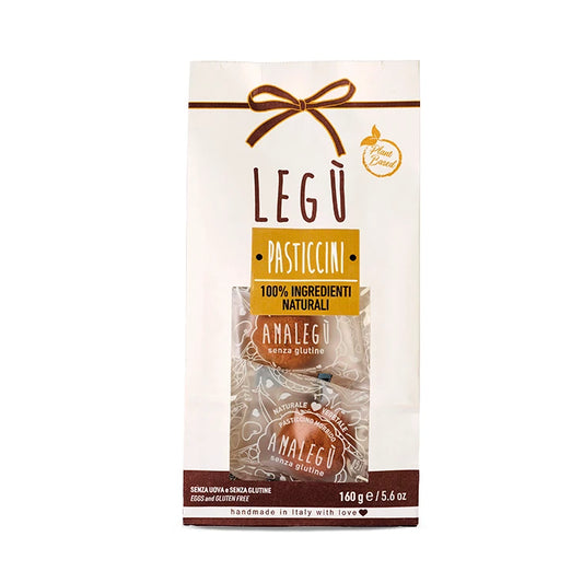 Packaging LEGÙ Pasticcini morbidi, confezione bianca con fiocco, etichetta "Plant Based", "senza glutine", "handmade in Italy".